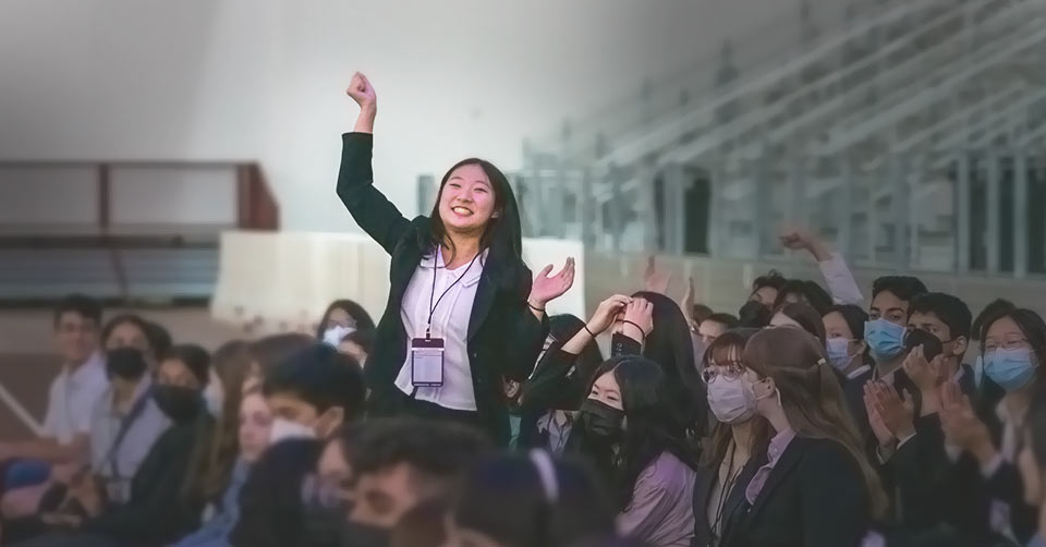 TXSEF participant happily cheering with raised fist